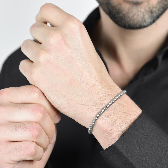 BRACCIALE UOMO IN ACCIAIO CON PERLE GRIGIE